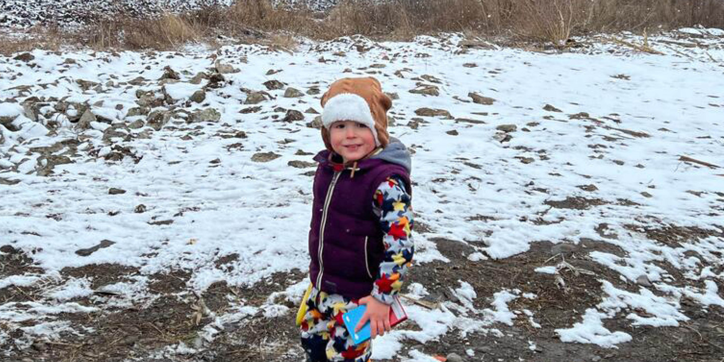 Yuriy looks out into the snow at the Romanian border