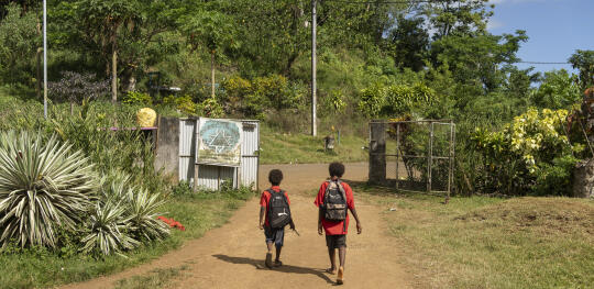 CH11495538 Jayson, 13, and his younger brother Rave, 9, walk to school in Efate Island, Vanuatu, which was hit by a massive 7.3 magnitude earthquake in December 2024. (1)