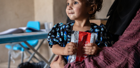 CH11131206 Roya (18 mths) is malnourished and eats therapeutic food at a clinic in Afghanistan