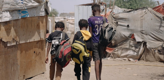 CH11000537 Kids walking in camp in Lahj Yemen