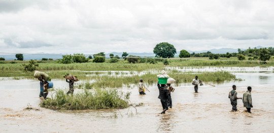 CH11008431 People walking through water after heavy floods in Malawi