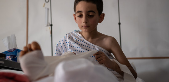 CH11032849 Ahmed 10 receives physiotherapy to repair his injured leg in Gaza
