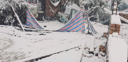 CH11522465 Snowfall damaged Earthquake affected people's tents in Kunar