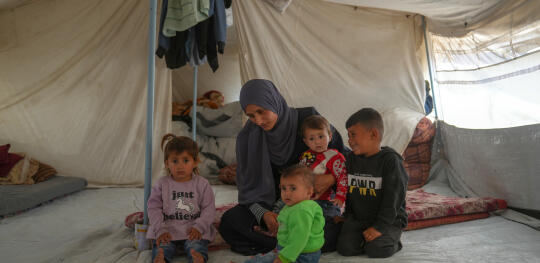 CH11596498 Ahlam (36) and her children, including twins Tala and Ghadeer (18 months), together in a tent