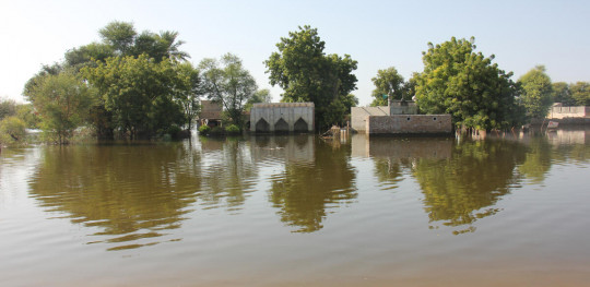 CH1732198 Floodwaters which have not receded in Pakistans Sindh province leaving villages houses schools and livelihoods still underwater