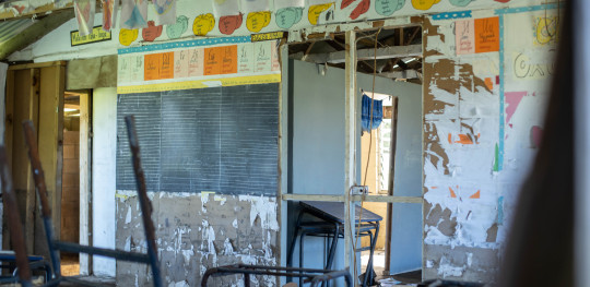 CH1740208 Damage and destruction to 10 year old Loses school after a volcanic eruption and tsunami in Tonga in 2022