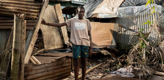 CH1802887 Rachel a 15 year old climate campaigner in front of her familys house that was badly damaged during the tropical cyclones Judy and Kevin that hit Vanuatu in March 2023