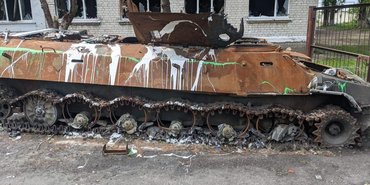 CH1683185 Burnt out tank outside a school in Bovary outside of Kyiv that was damaged during the war in Ukraine