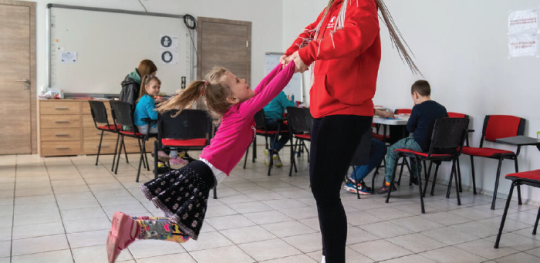 Thumbnail CH1818316 Olga Shults Save the Childrens programme manager is playing with girl at Child Friendly Space in Mykolaiv Ukraine