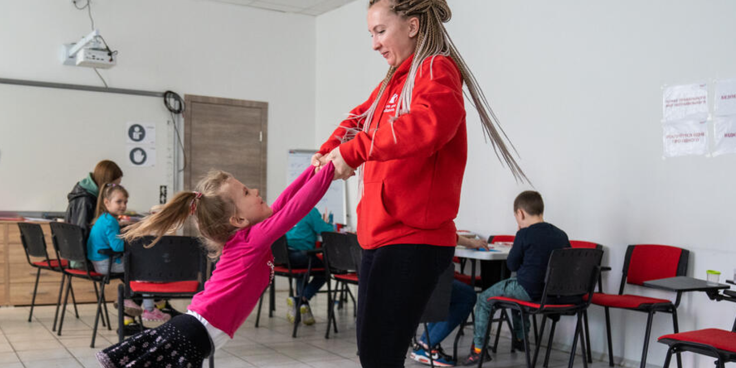 carousel image 3 CH1818316 Olga Shults Save the Childrens programme manager is playing with girl at Child Friendly Space in Mykolaiv Ukraine