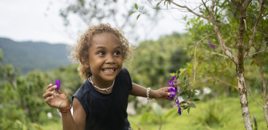 CH1818555 Lucy four playing outside her home in Malaita Province the Solomon Islands.