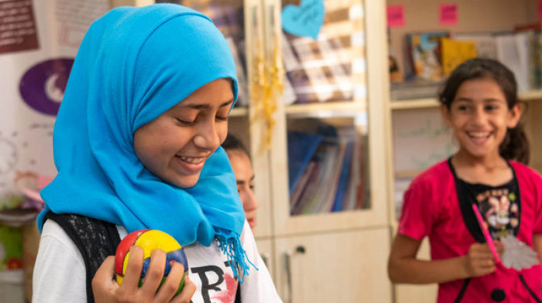 children having fun in Save the Children classroom