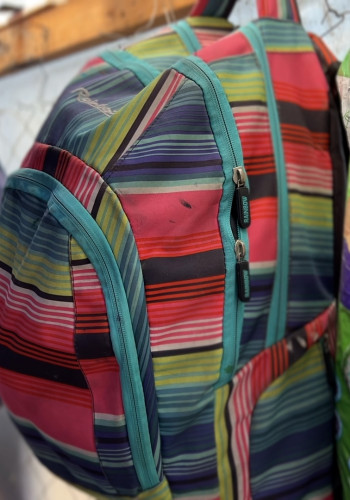 CH11017705 The belongings of Zainabs family hanging inside the tent where they live after they were displaced to Rafah Gaza v2