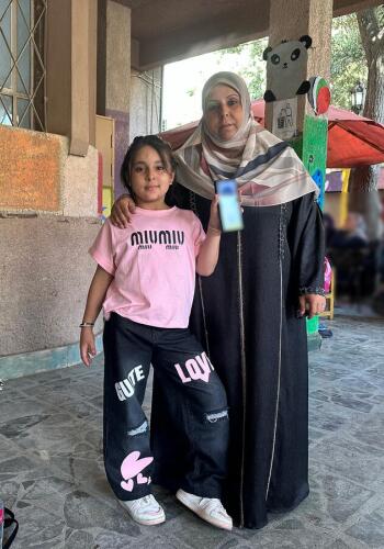 CH295175 Layan (9) and her mother Reem (38) at a child friendly space in Egypt (1)