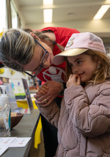 Save the Children Advocacy Director Jacqui Southey shows her granddaughter six year old Scarlett the voting booth 1 v2