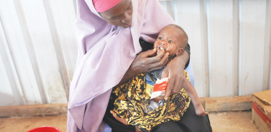 CH1691971 Casho and her nine month old daughter Fawzia receiving treatment for malnutrition at Save the Childrens health clinic in Baidoa 1