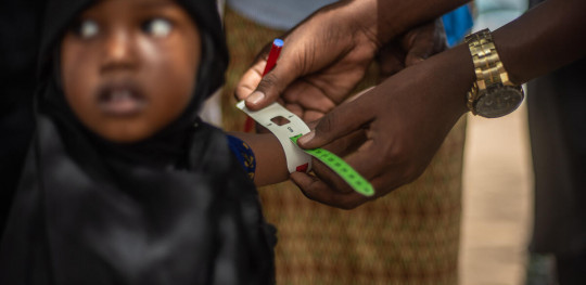 CH1697063 Ajabo 3 is screened for malnutrition by a Save the Children outreach team in a drought hit village in northern Kenya
