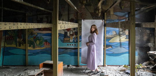 CH1821262 Nadiya 16 poses for a portrait at her damaged school outside of Kyiv