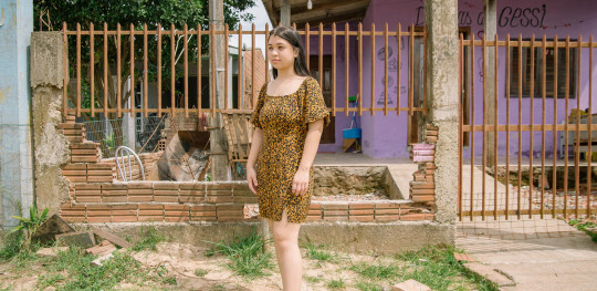 CH11265999 Denise in front of the house she lost to flooding in Brazil